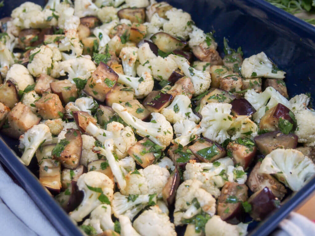 This roasted cauliflower and eggplant salad/side makes a versatile accompaniment to many meals. Great roasted veg flavor with a fresh herby, citrus dressing.