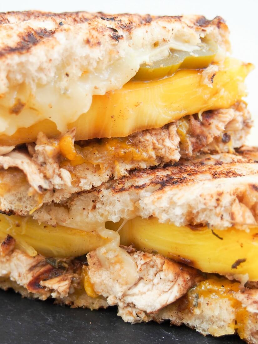 "The Jammin' Jamaican" chicken grilled cheese: This chicken grilled cheese is a delicious sweet spicy mix of Caribbean flavors in sandwich form - a quick mango jam, spiced chicken, grilled pineapple & more. Yum!