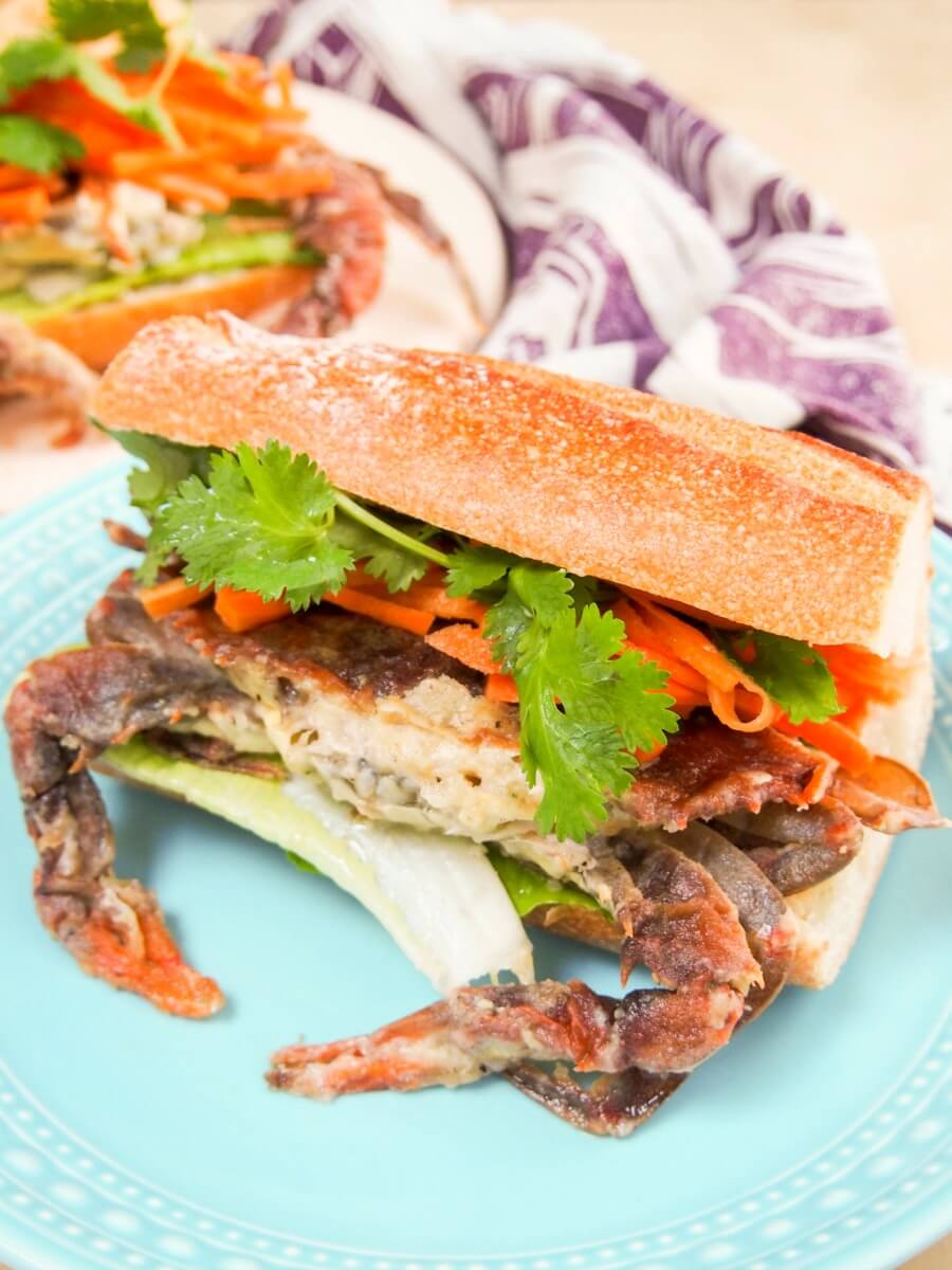 bahn mi style soft shell crab sandwich This bahn mi-style soft shell crab sandwich may be messy to eat, but it's one of the tastiest sandwiches you'll ever eat. With pickled carrots & sriracha mayo.