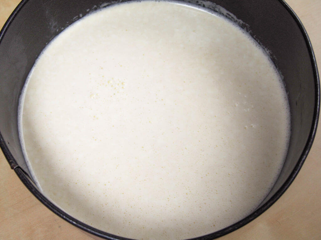 cheesecake mixture in tin before baking