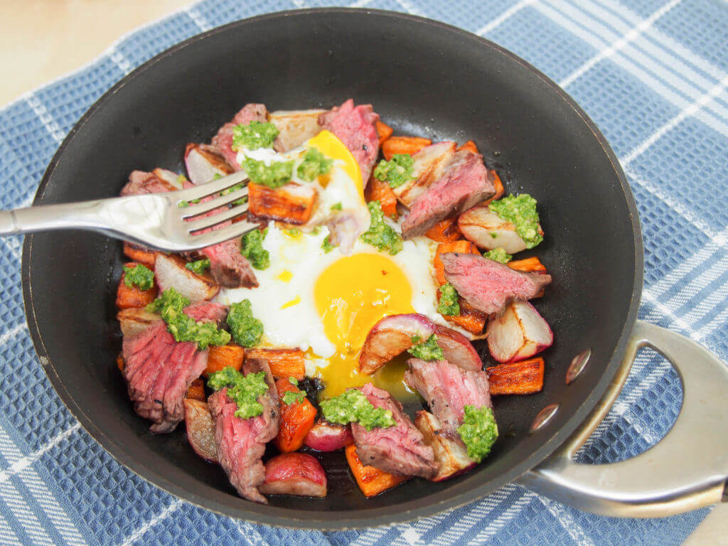 Treat someone to this steak & egg breakfast skillet with sauteed radishes, carrots and radish green pesto - it's a delicious balance of flavors, & easy too.