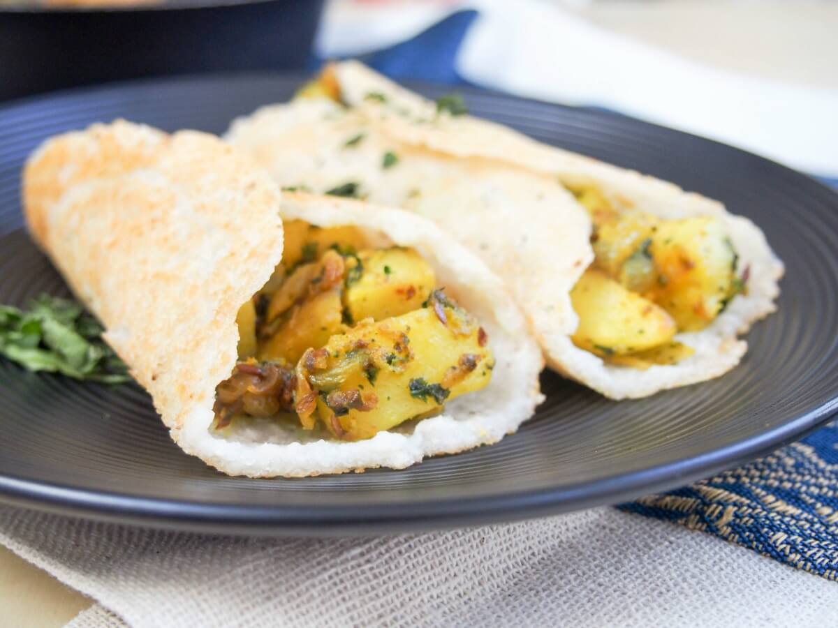 masala dosa are a traditional South Indian savory pancake with a spiced potato filling. Light and crisp, they're a delicious snack or lunch. Gluten free, vegetarian & vegan.