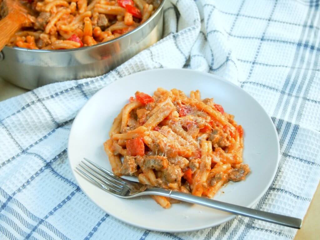 Spicy sausage pasta skillet - 1 pan + 7 ingredients = a delicious dinner. So much flavor, hearty and sure to please all, especially the cook being easy too.