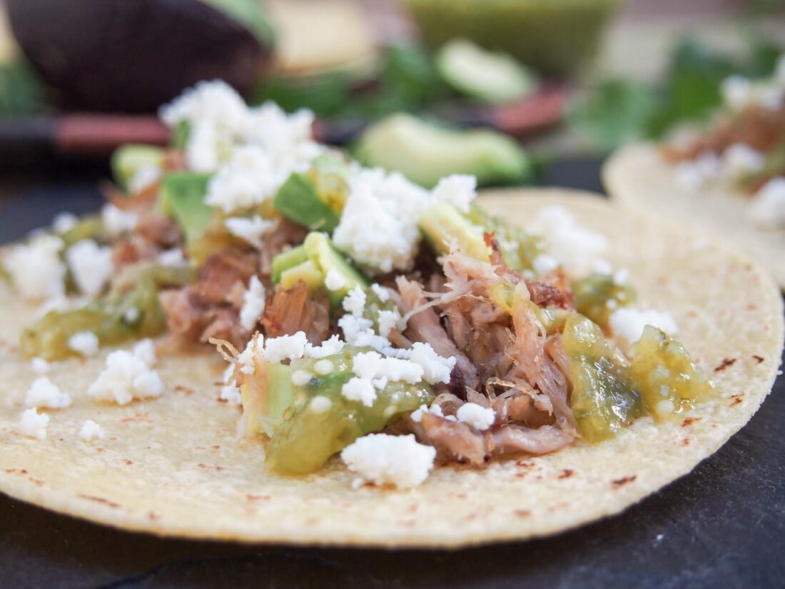 Pork carnitas tacos with tomatillo salsa verde