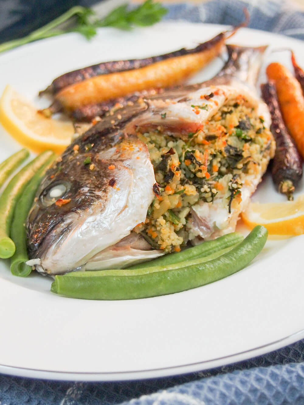 This chard couscous stuffed fish is a delicious take on baked whole fish. With a lemony undertone, this dish is flavorful and impressive looking too. 