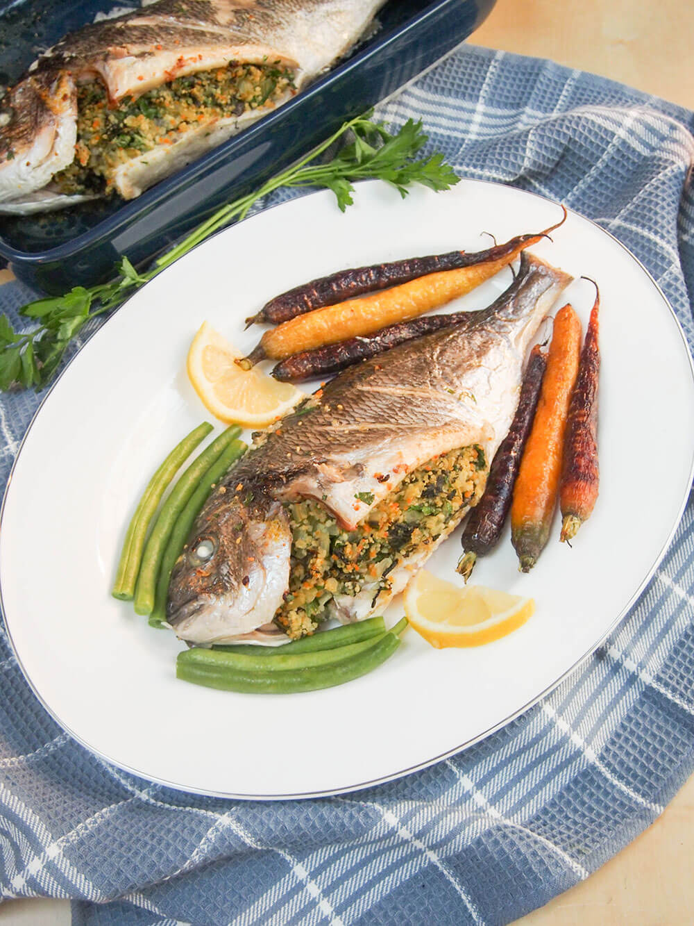 chard couscous stuffed fish on plate