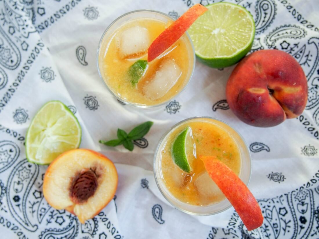This basil peach margarita is deliciously fresh and fruity, easy to make and all too easy to enjoy. Perfect for taco Tuesday, parties or just because.