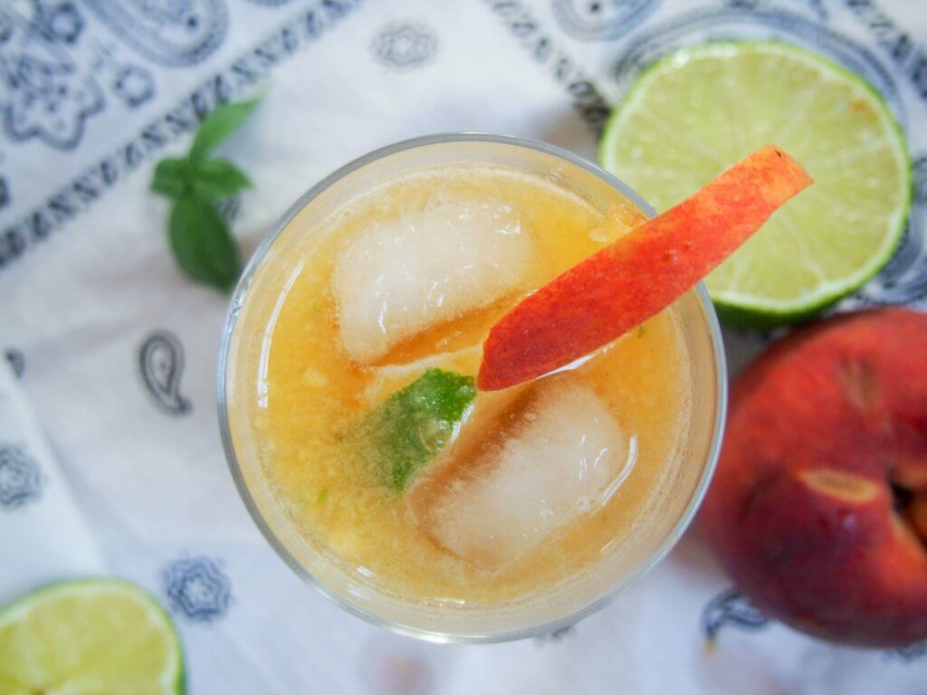 This basil peach margarita is deliciously fresh and fruity, easy to make and all too easy to enjoy. Perfect for taco Tuesday, parties or just because.
