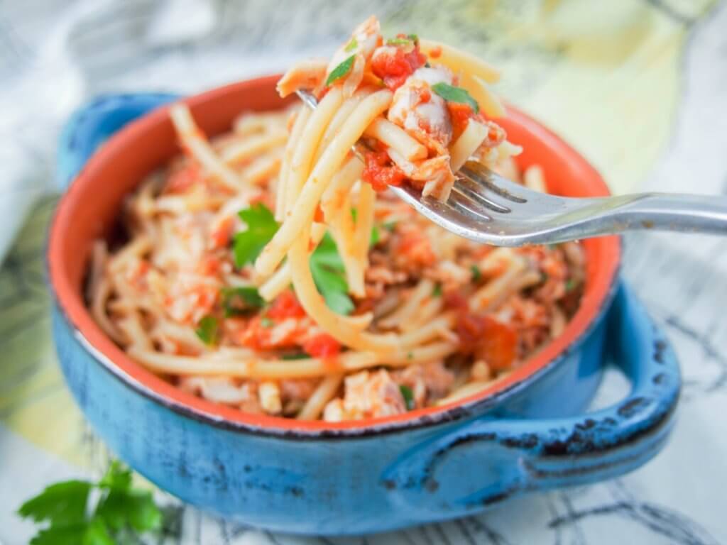 Fish ragu pasta is a tasty, simple combination of a tomato and fish-based sauce over pasta. Vary the fish for a fuller or fresher flavor, but all delicious.