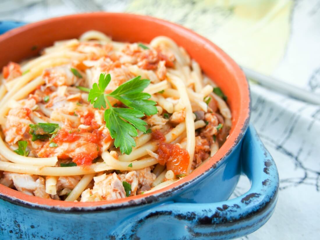fish ragu pasta in bowl from side