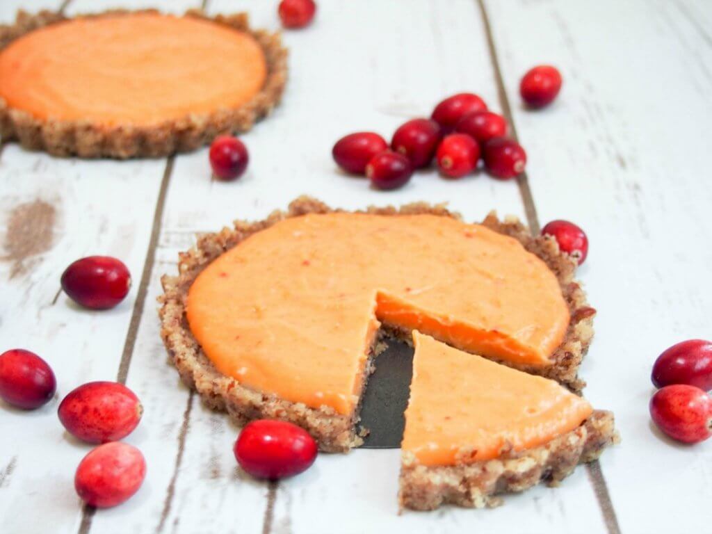 This cranberry lemon curd tart is as delicious as it is pretty. The fresh zesty topping goes so well with the nutty base. Plus it's no bake and gluten-free.