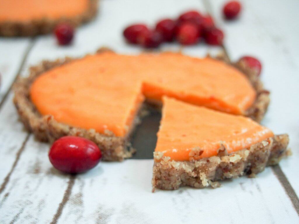 This cranberry lemon curd tart is as delicious as it is pretty. The fresh zesty topping goes so well with the nutty base. Plus it's no bake and gluten-free.
