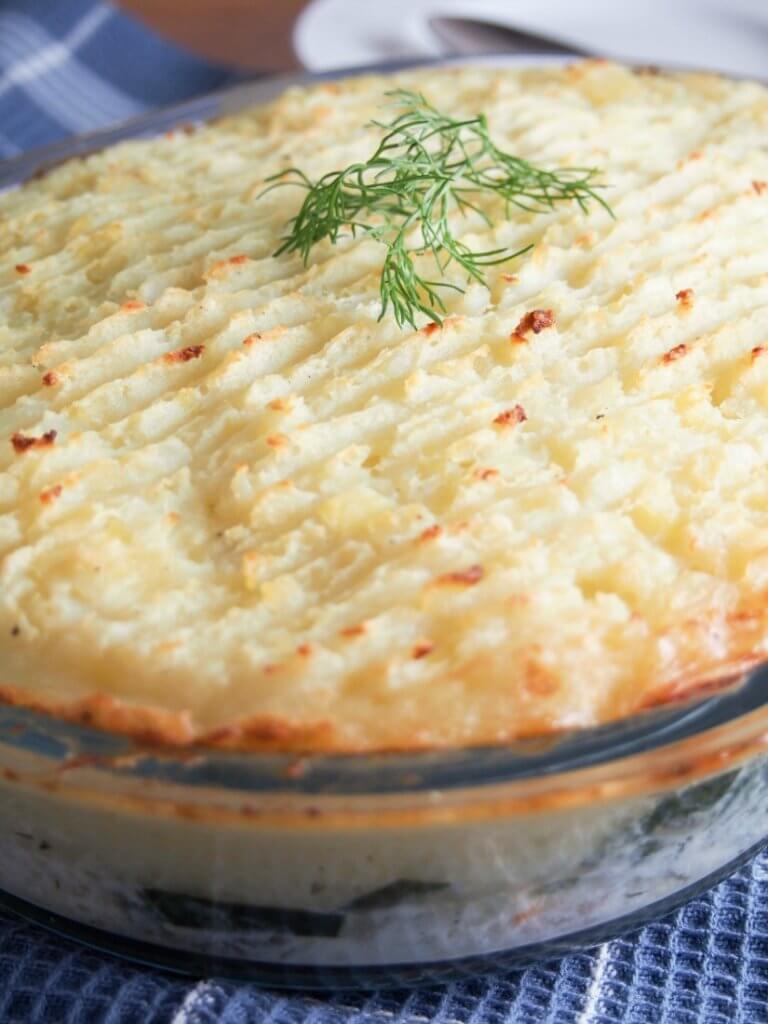 Fish pie is a potato topped fish bake that's a British comfort food classic. Filled with fish, shrimp and topped with potatoes. Easy to make, easy to enjoy. 