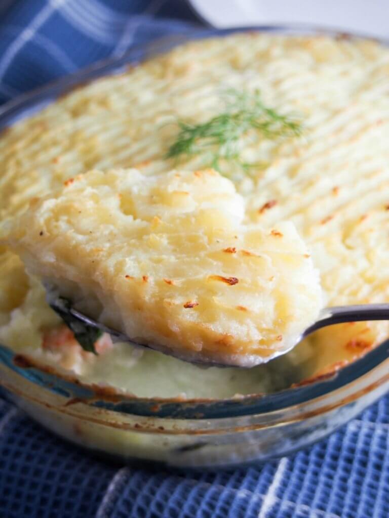 Fish pie is a potato topped fish bake that's a British comfort food classic. Filled with fish, shrimp and topped with potatoes. Easy to make, easy to enjoy. 
