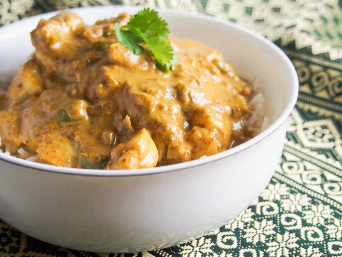 Goan fish curry in bowl viewed from side