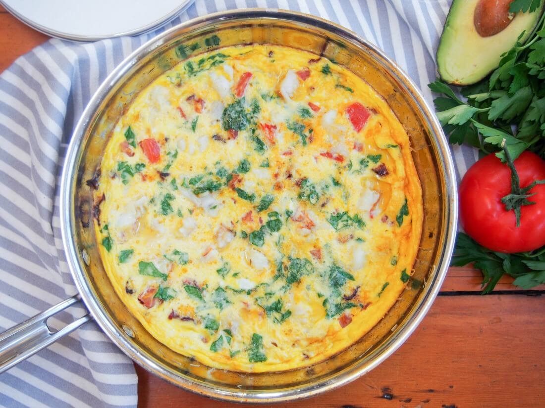 bacon lobster omelette in skillet viewed from overhead