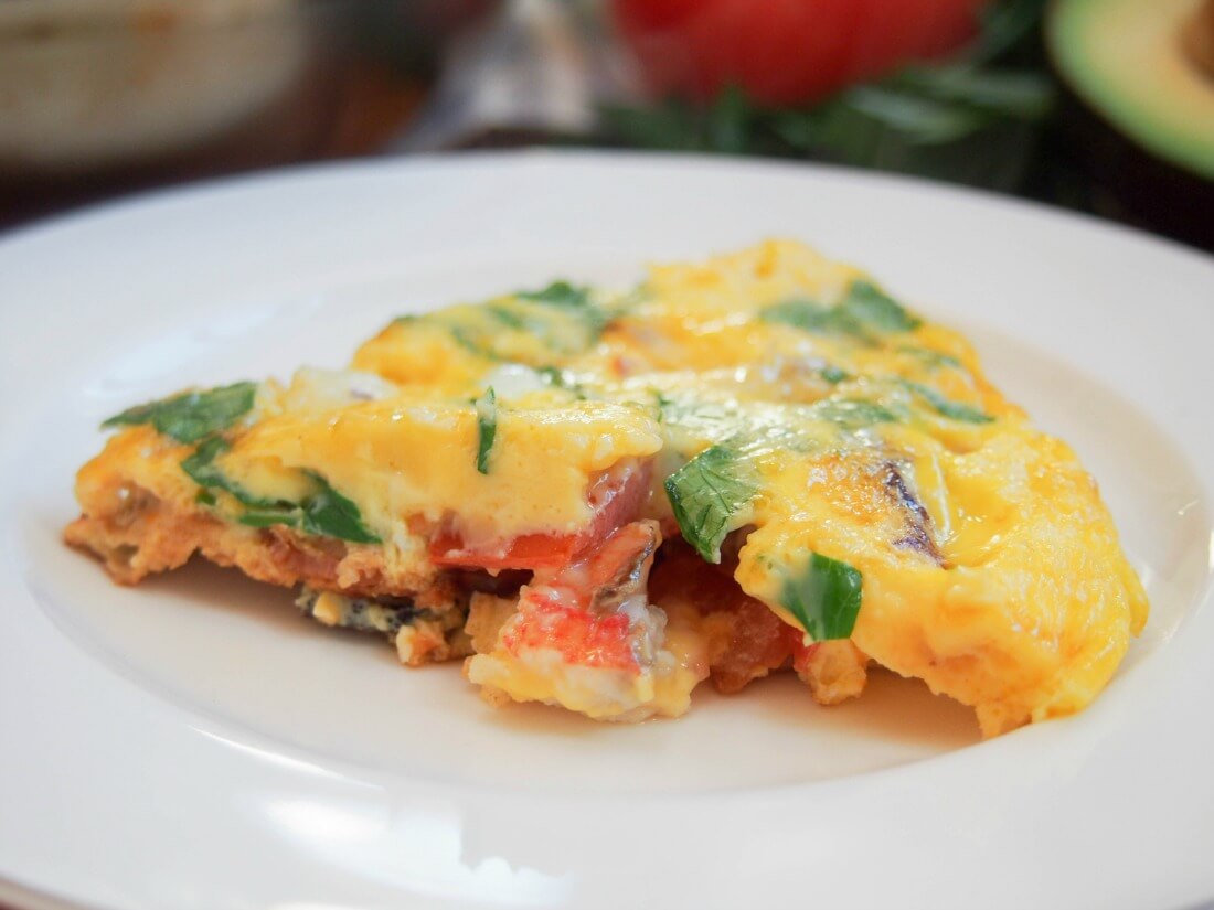 slice of bacon lobster omelette on plate