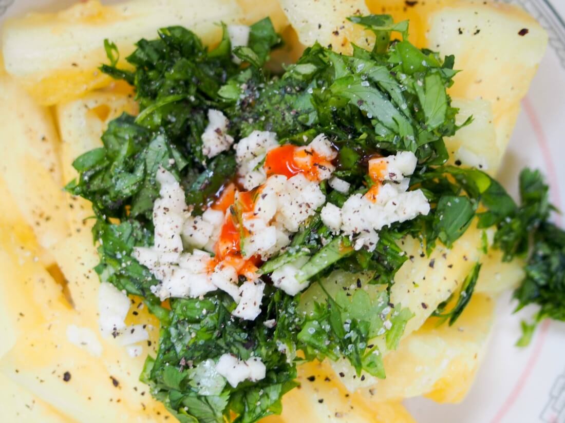 pineapple, cilantro, garlic and hot sauce in bowl, ready to mix
