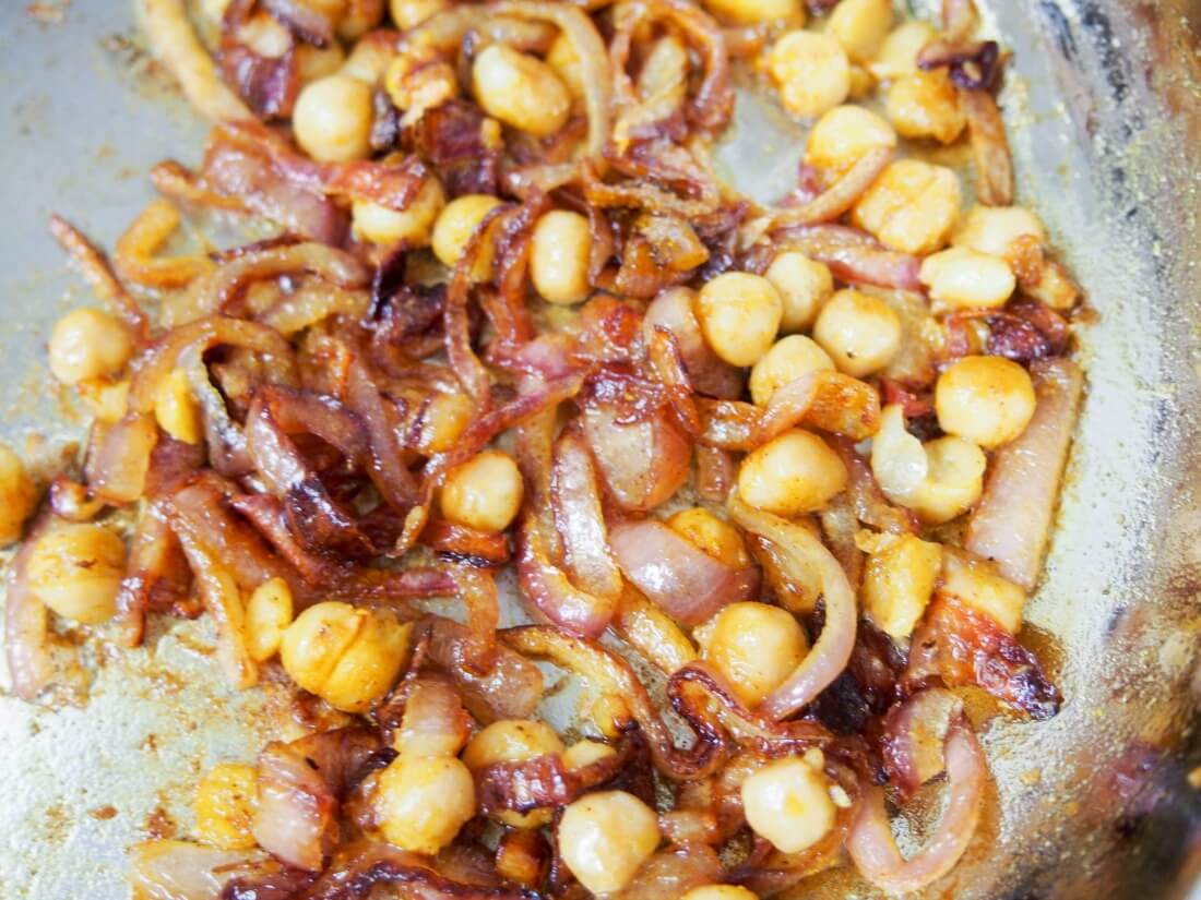 cooking onions and chickpeas to top soup