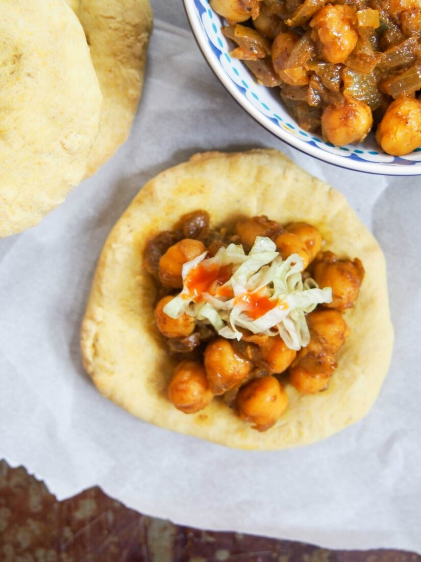 Trinidadian doubles is a tasty, easy vegan snack formed of spiced flatbread with a simple chickpea curry filling. Full of flavor and perfect finger food.