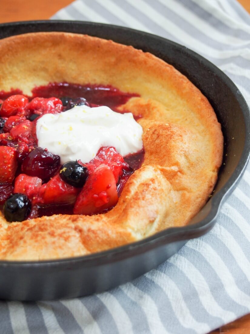 individual Dutch baby pancake with berries and maple yogurt