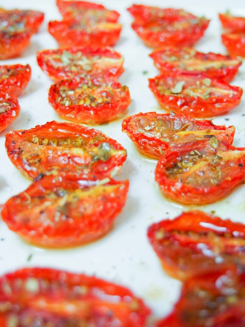 slow roasted tomatoes cooling in dish