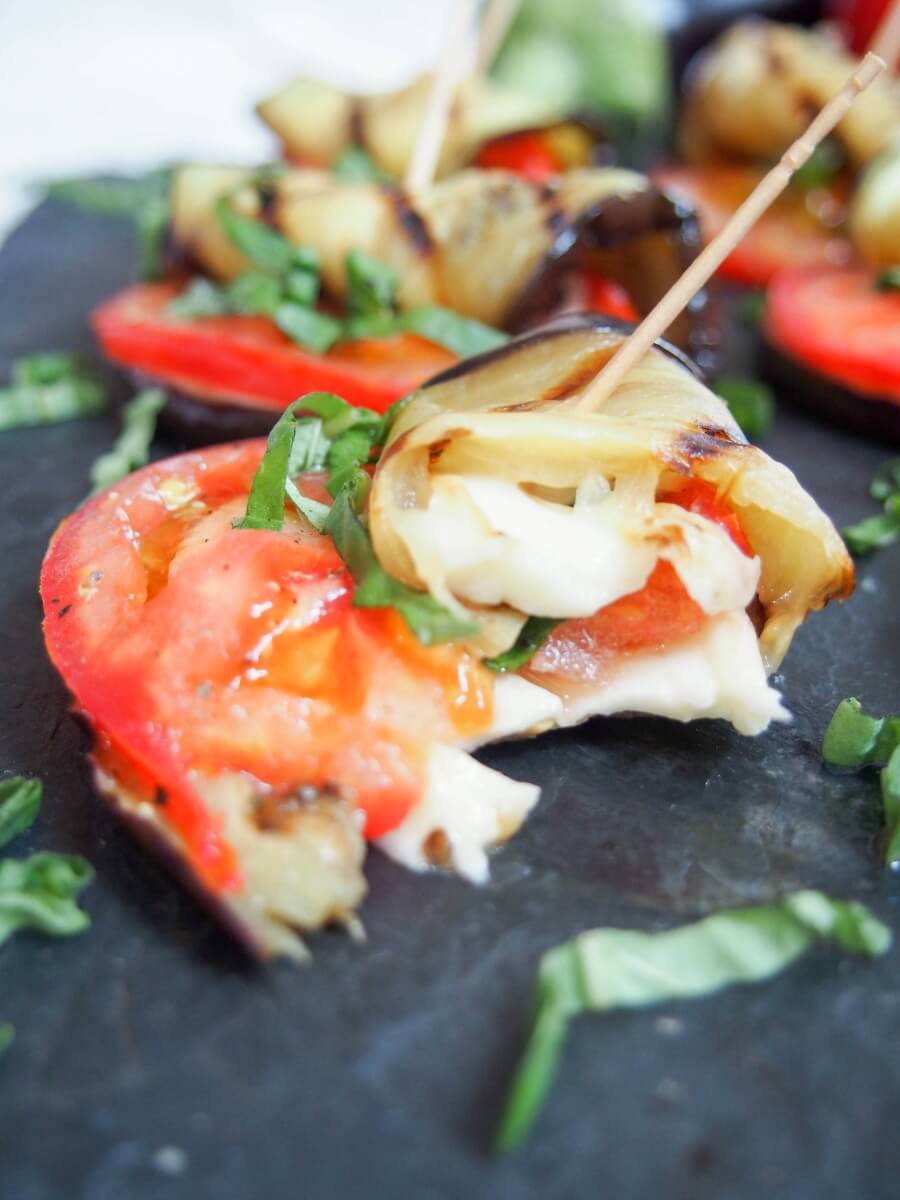 caprese grilled cheese roll up with bite taken out of it