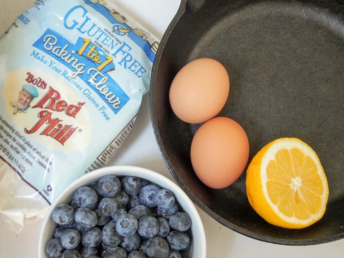 flour and blueberries to side and eggs and lemon in skillet