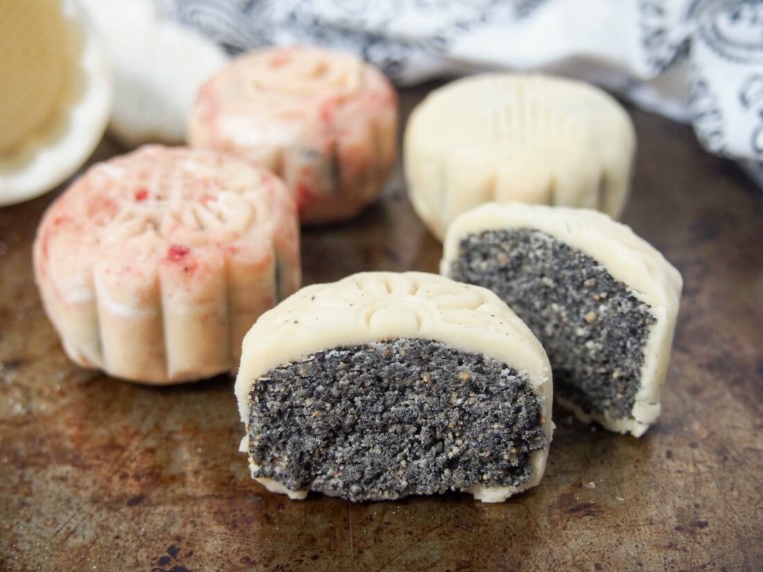 Chinese mooncakes snow skin mooncakes with some whole and one cut at front