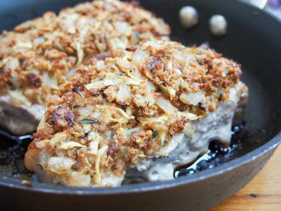 apple stuffing crusted pork chops in skillet