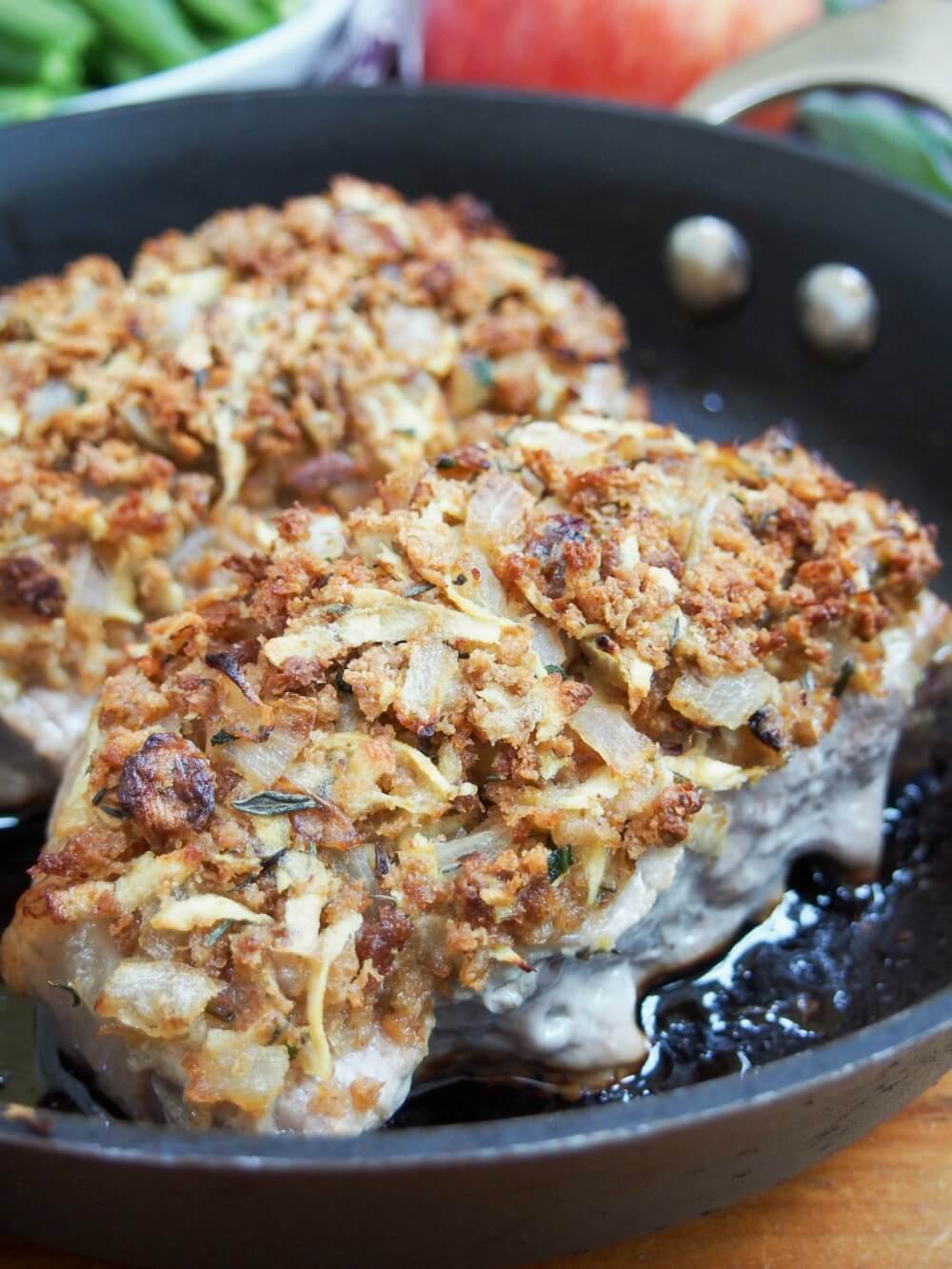 close up view showing stuffing on top of apple stuffing crusted pork chops