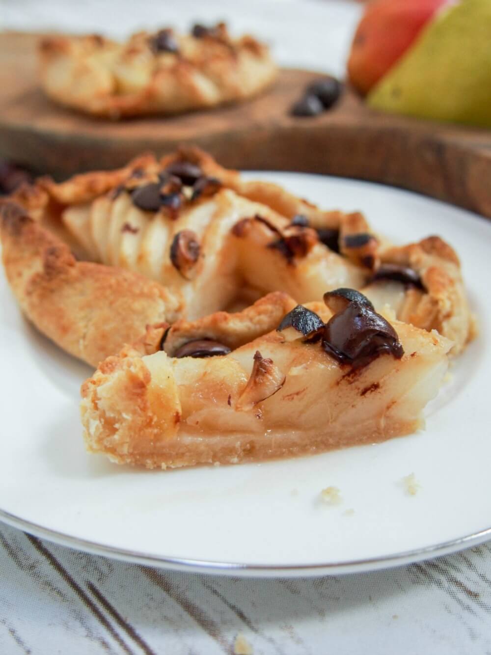 slice of galette cut and sitting in front of rest showing layers of pear