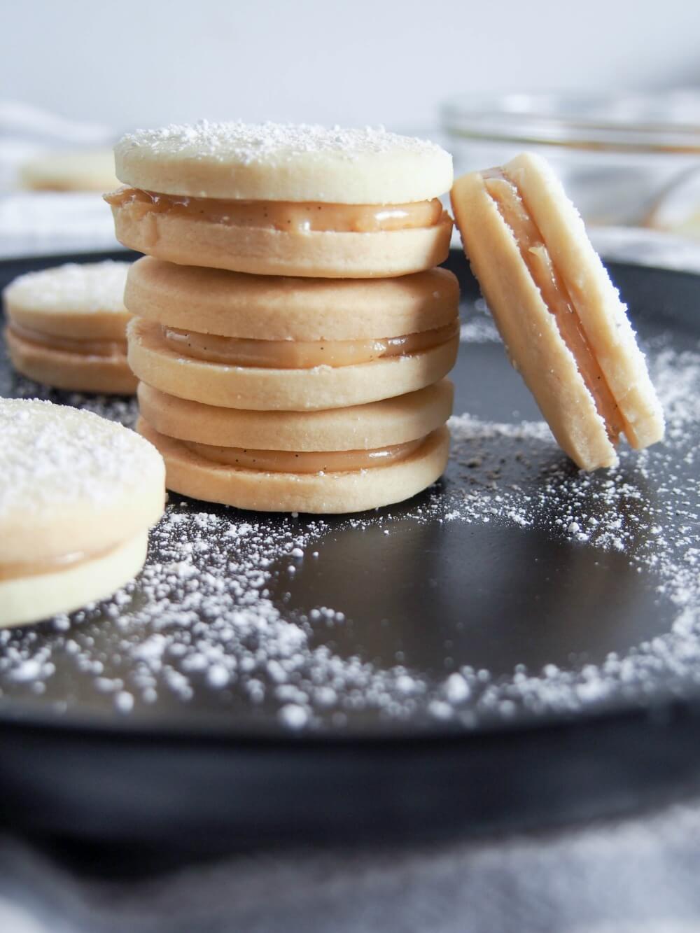 Alfajores - dulce de leche sandwich cookies - sitting in a stack on a plate