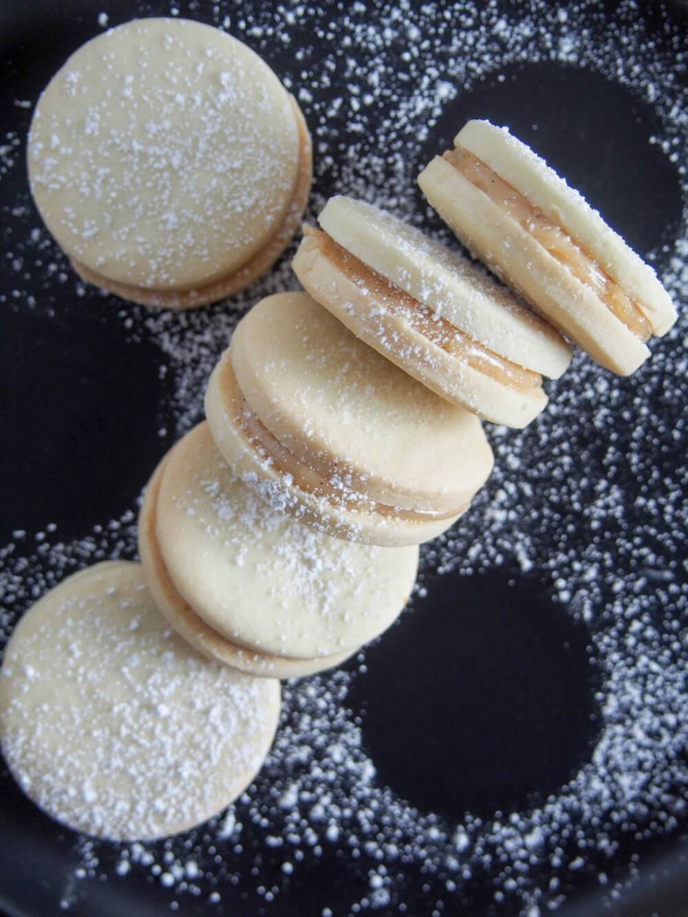 Alfajores - dulce de leche sandwich cookies on side from overhead
