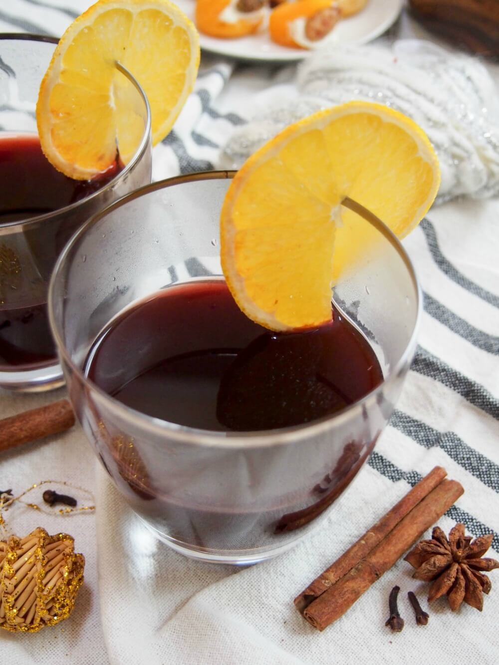 gluhwein German mulled wine in glass with spices to side