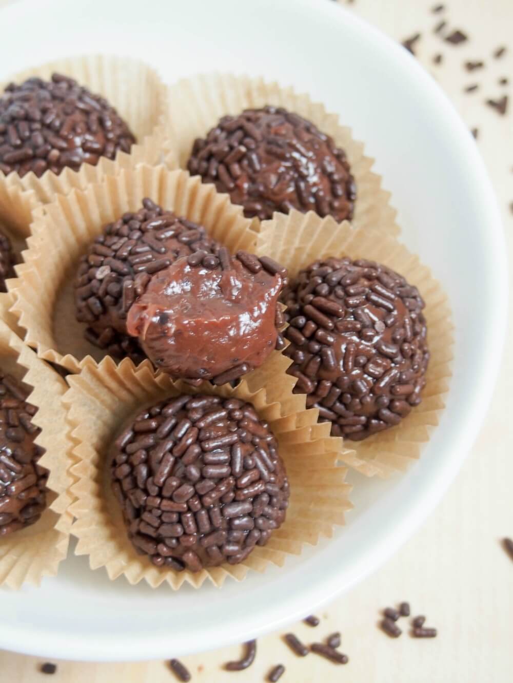 Brigadeiros are a kind of fudge/truffle from Brazil that's often enjoyed for carnival, but really I think most people will make any excuse. They’re a really easy sweet treat that the whole family will love. brigadeiros Brazilian truffles with bite taken out