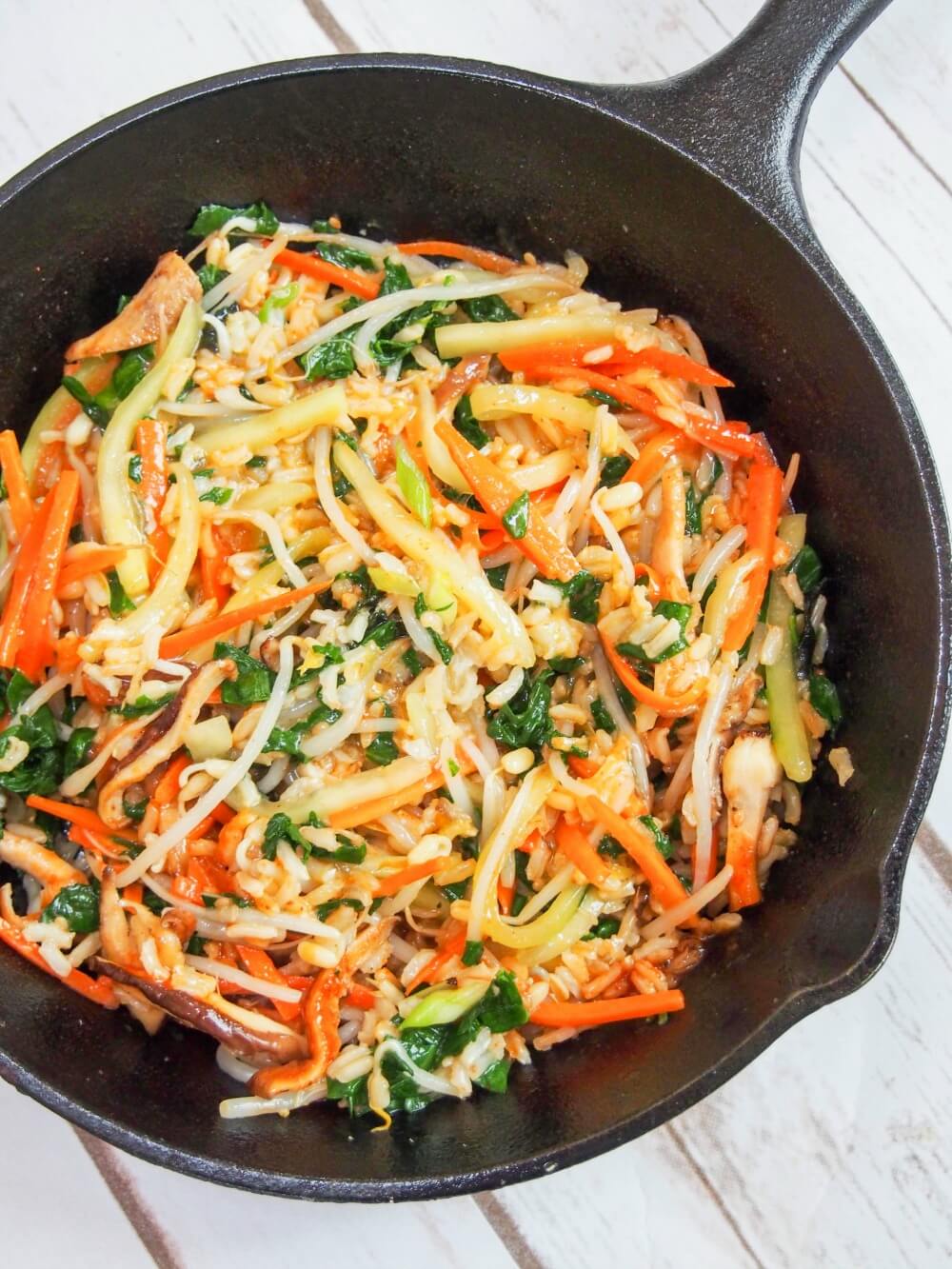 vegetarian bibimbap mixed together in skillet
