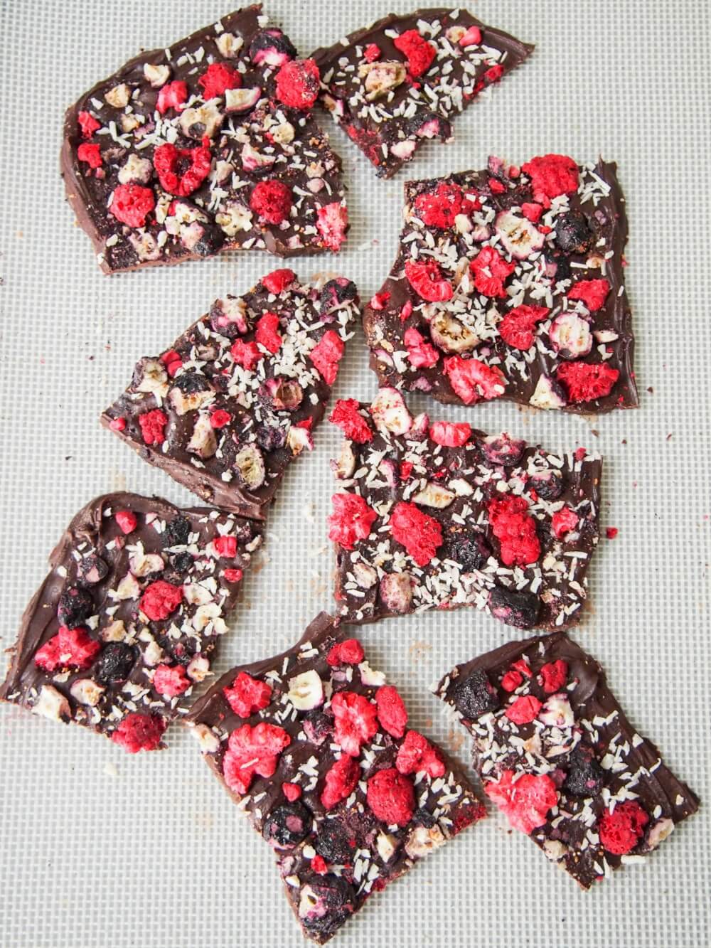 breaking up firmed-up blueberry raspberry chocolate bark into chunks