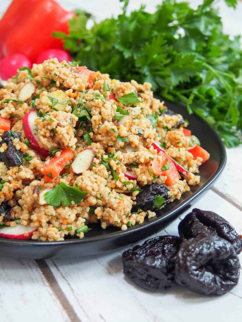 This couscous salad is packed with crunchy vegetables, a creamy prune vinaigrette, and is vegan too. Easy to make and great as a side, lunch or take it on a picnic. 