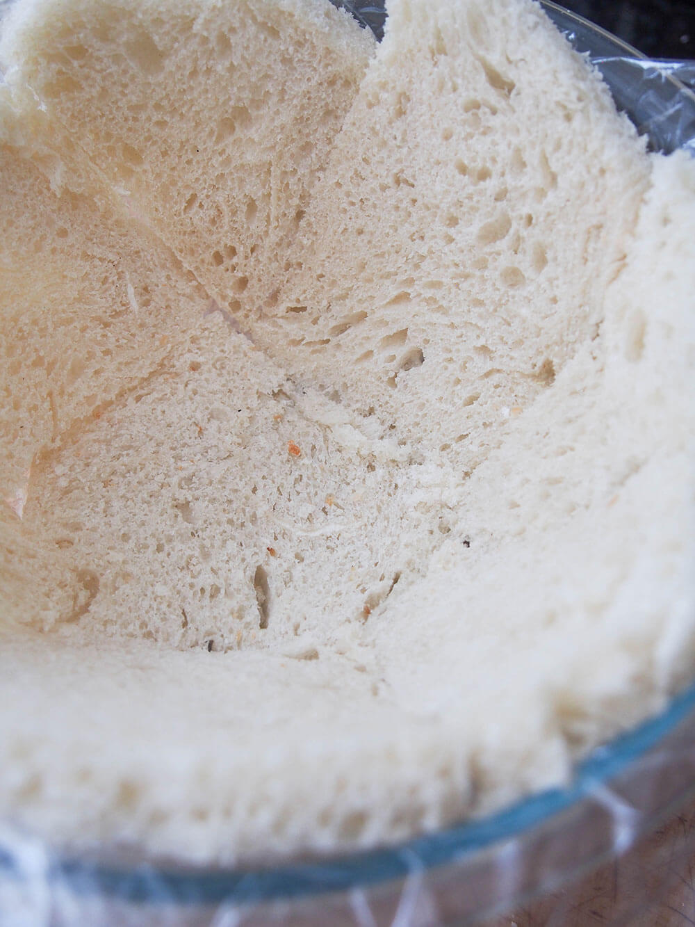 bread lining bowl for summer pudding ready to be filled