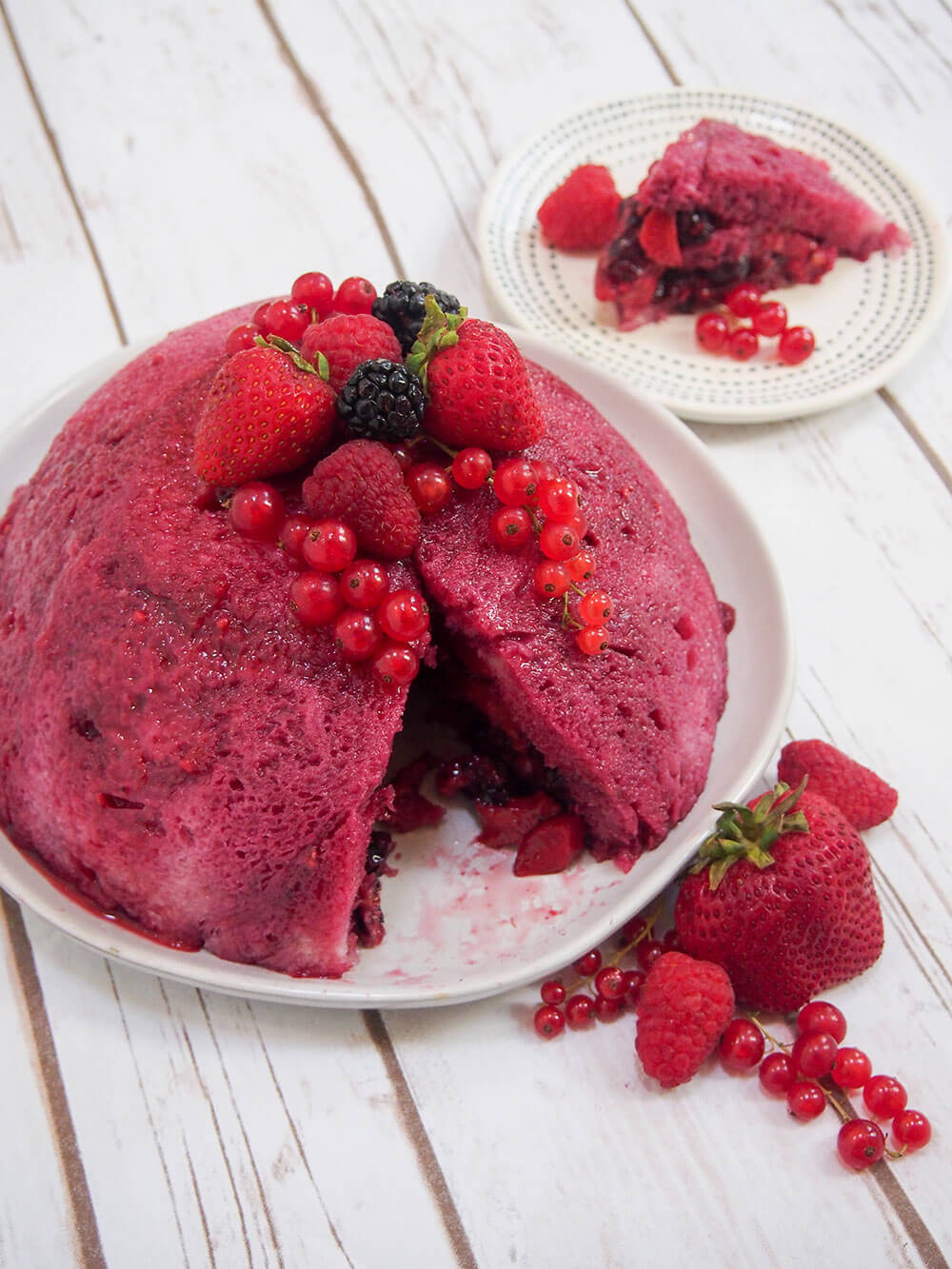 summer pudding with a slice cut from it viewed from above