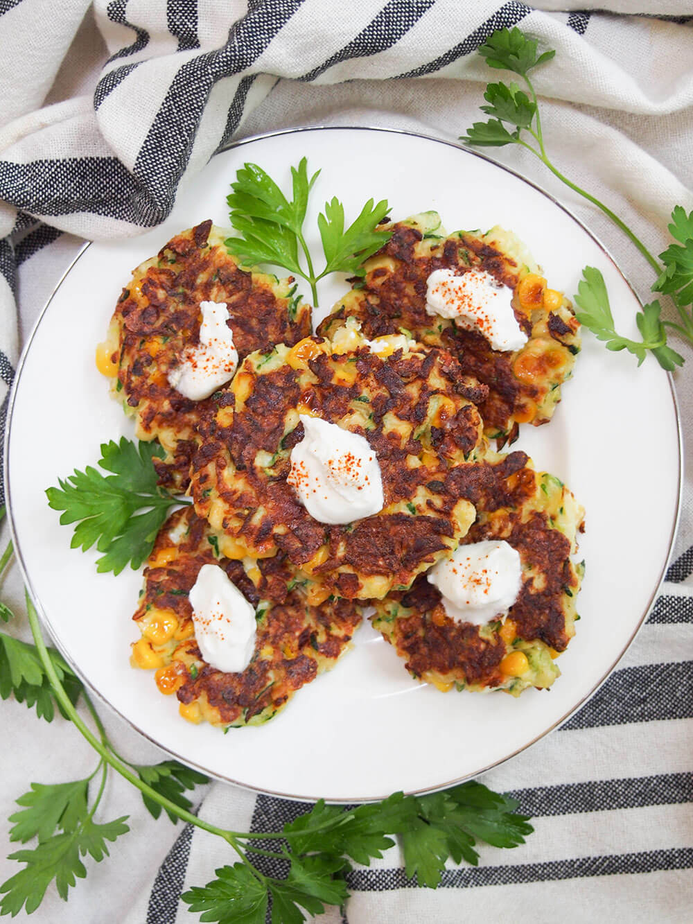 plateful of zucchini corn fritters viewed from overhead