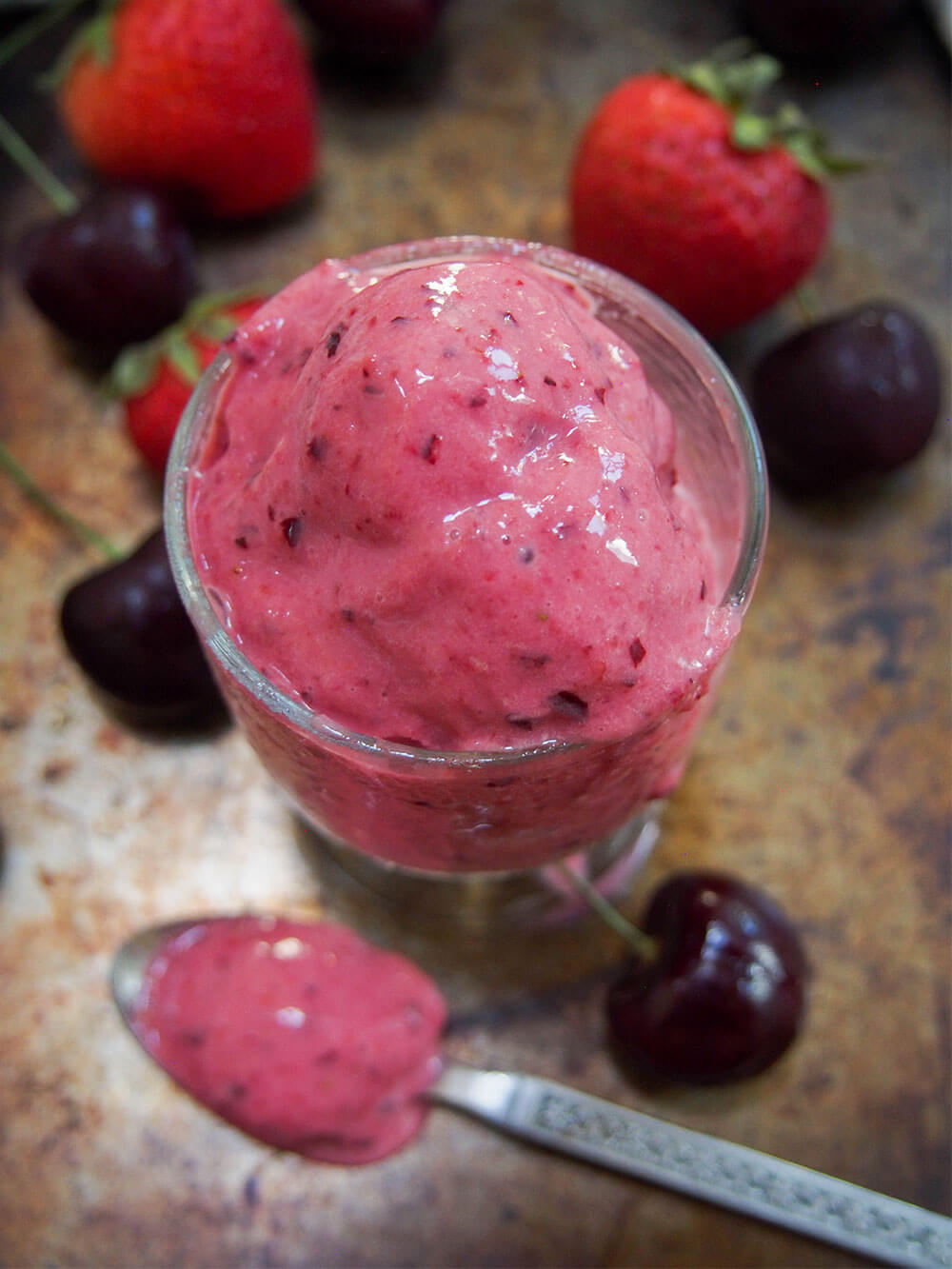 glass of cherry strawberry frozen yogurt close up