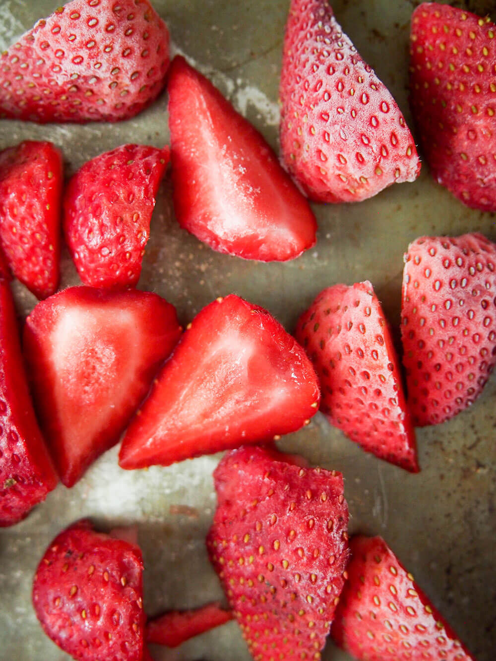 frozen strawberries on baking sheet