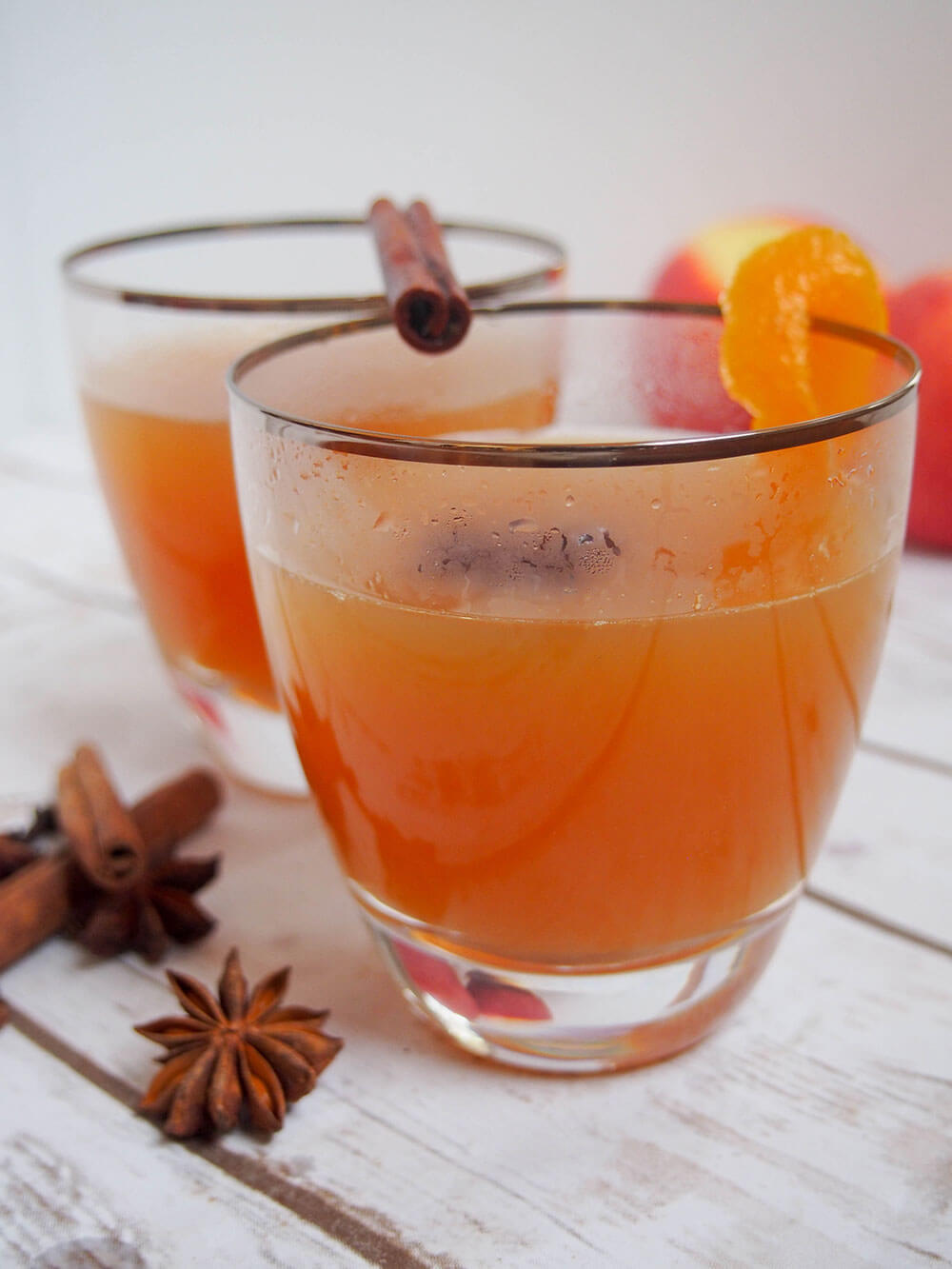 glass of spiked mulled apple cider slightly steamed up 