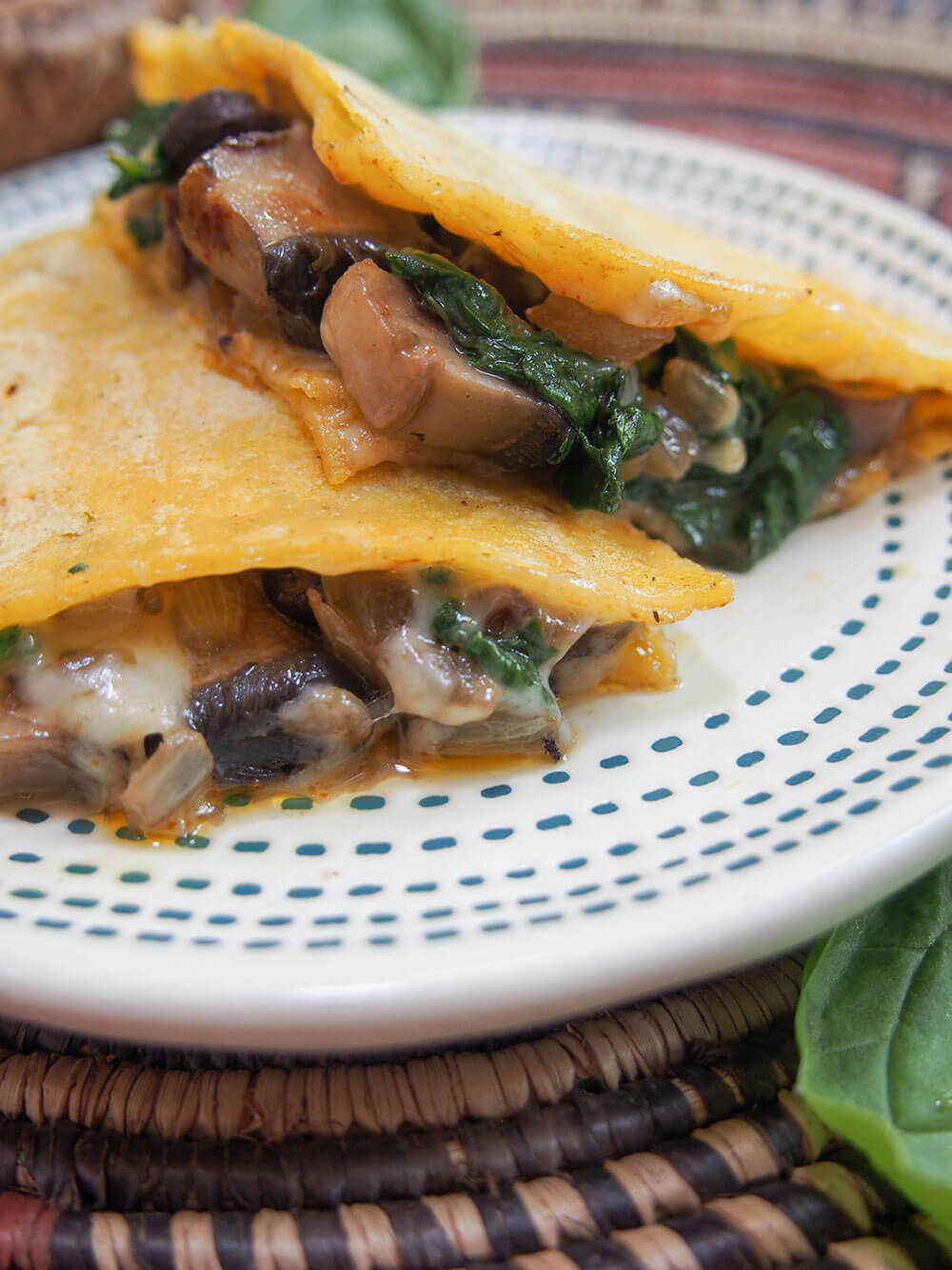 side view of pieces of mushroom quesadillas showing filling