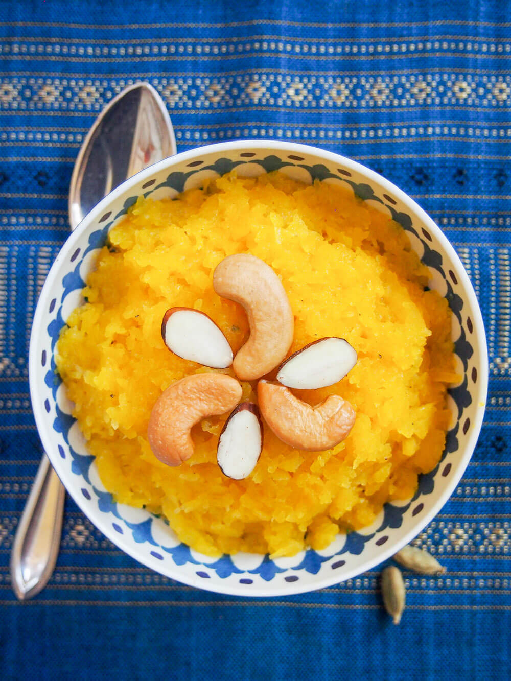 bowl of pumpkin halwa with spoon to side