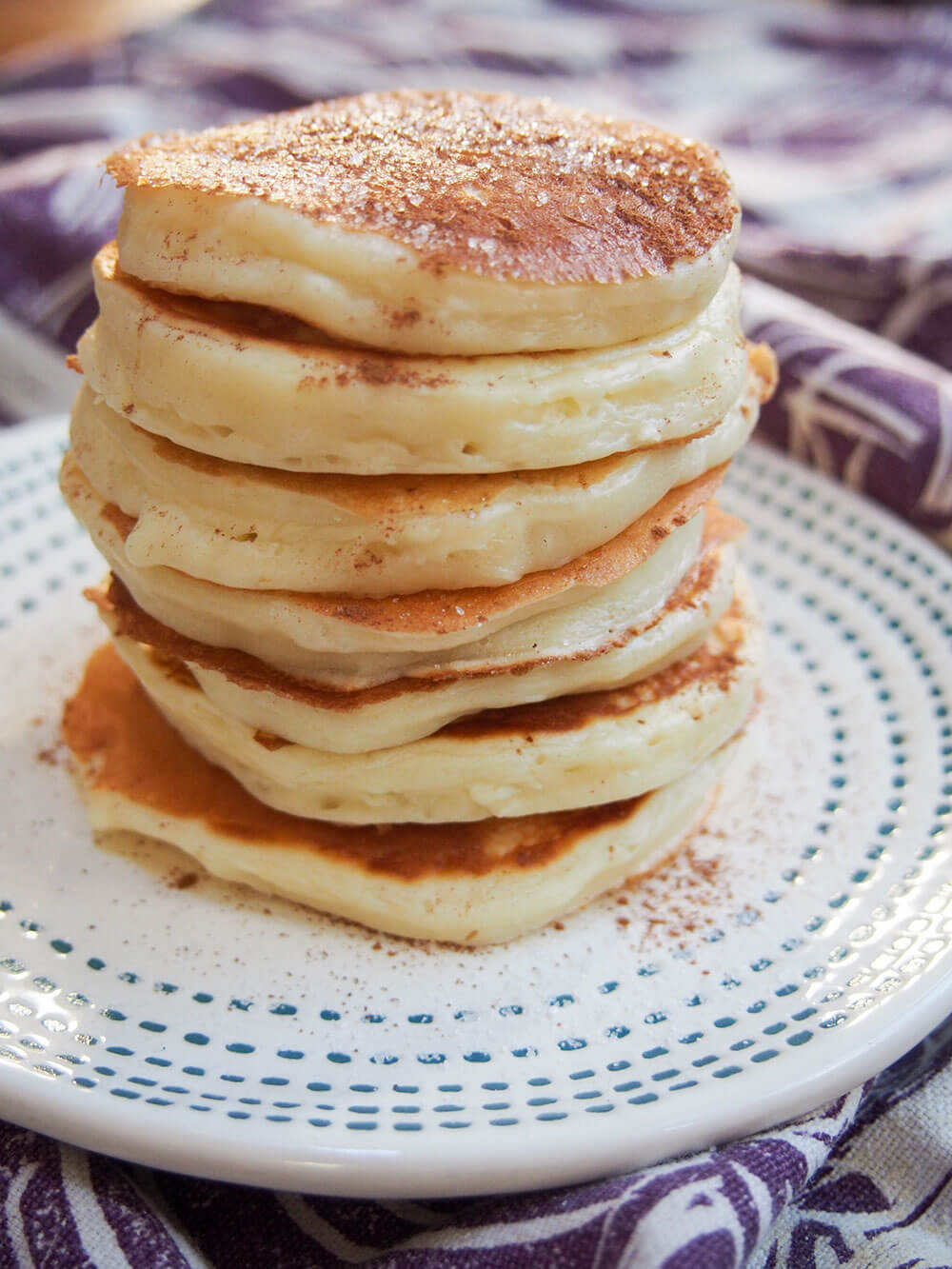 cheese latkes in a stack on a plate