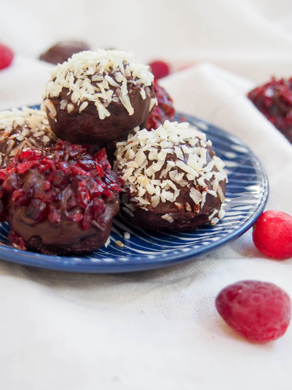 cranberry truffles on dish from side