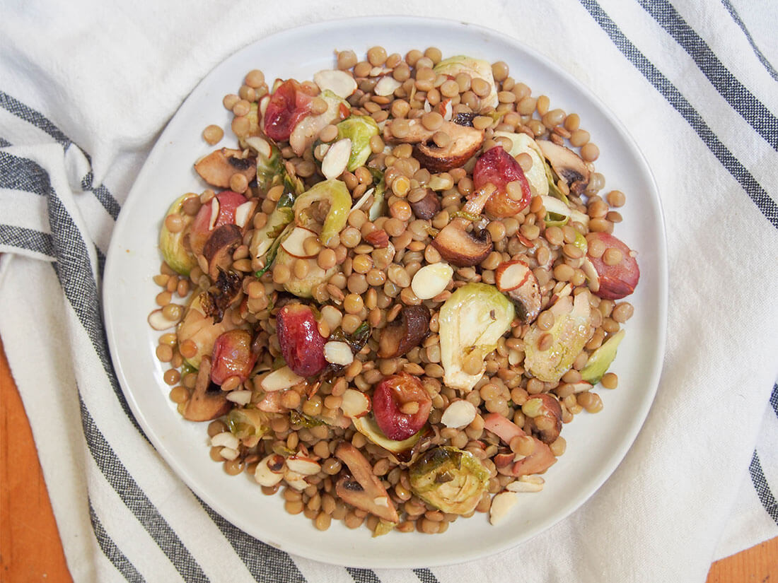 plate of vegan lentil salad with roasted Brussels sprouts from overhead